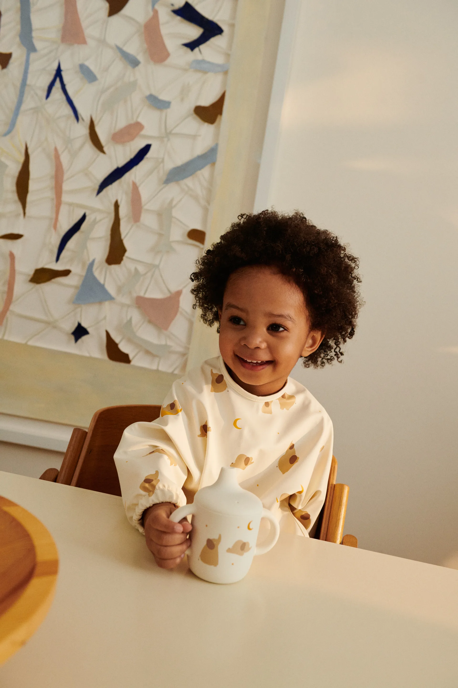 Bavoir à manches Merle, Elephant-Creme de la creme Liewood