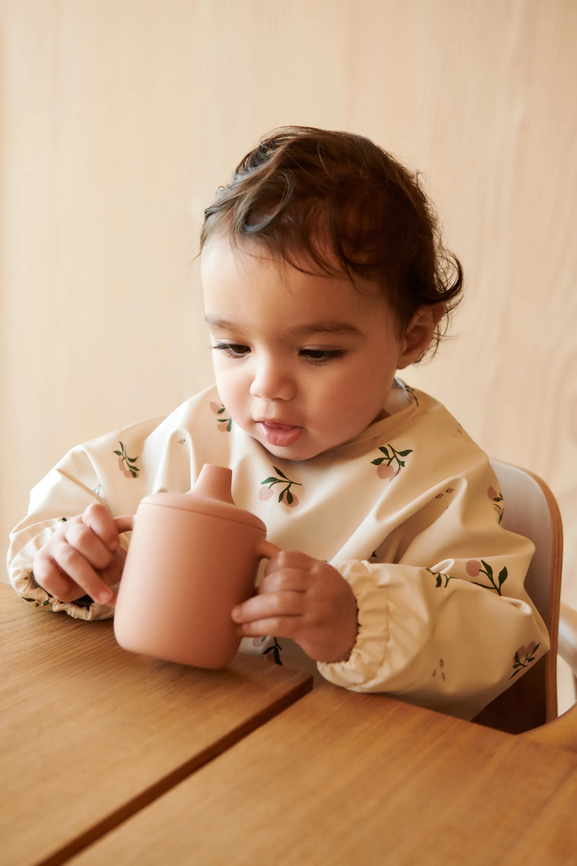 Bavoir à manches Merle, Peach-Sea shell mix Liewood