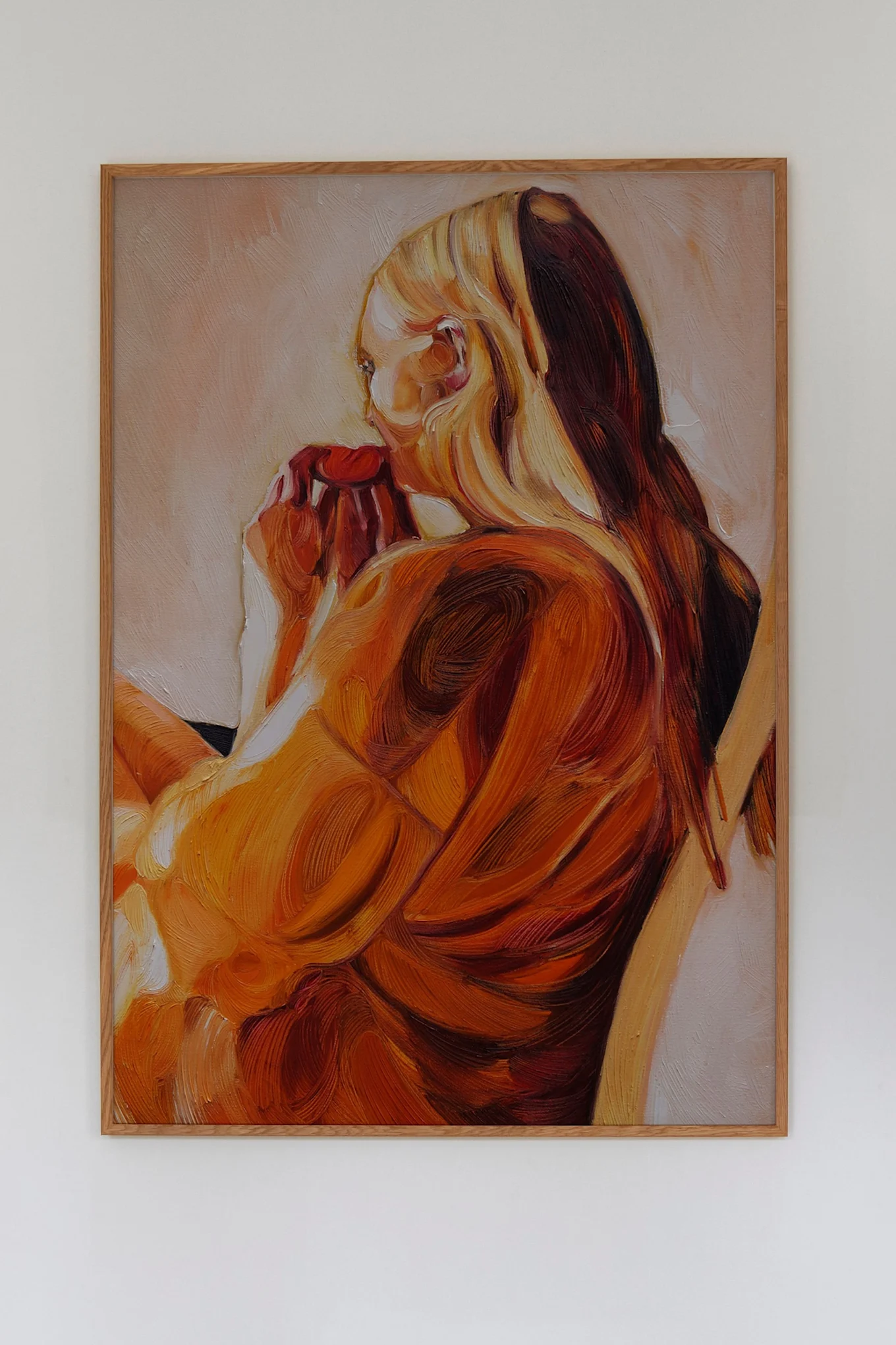 Affiche de Paper Collective dans les tons orange et avec un motif peint représentant une femme. 