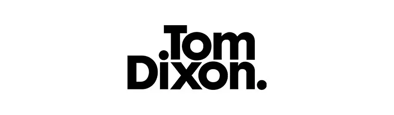 Logo Tom Dixon, avec le texte '.Tom' superposé au-dessus de 'Dixon.' en caractères gras noirs sur fond blanc.